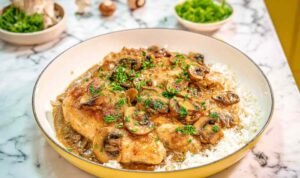 Chicken Marsala in skillet with creamy sauce